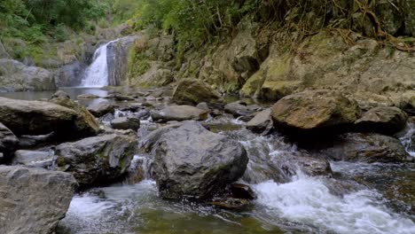 stream flowing over rocks at crystal cascades near cairns in redlynch, queensland, australia