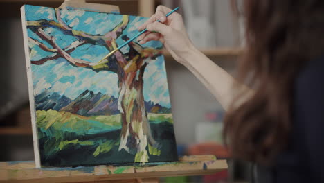 woman painting a landscape