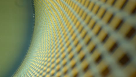 Pulling-away-from-a-macro-view-of-a-curved-metal-grid