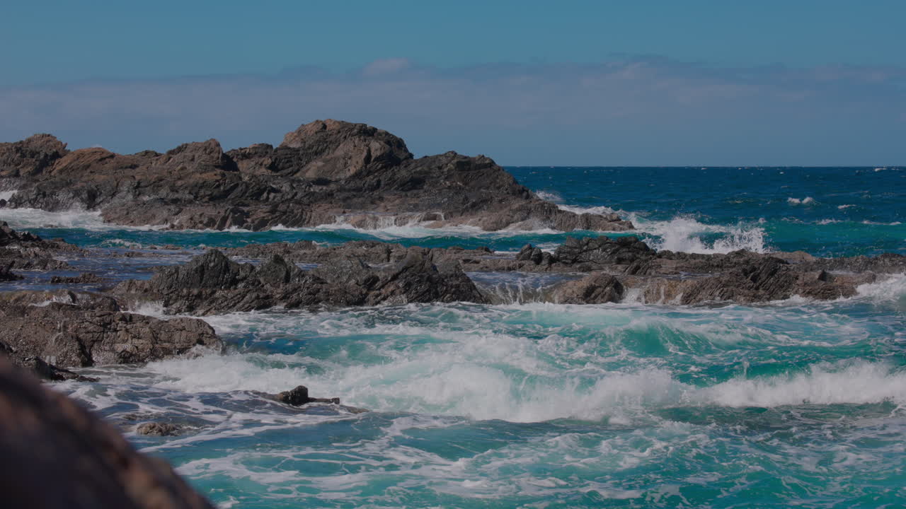 Breathtaking views of Fuerteventura with Lobos Island, Red Flag Beach, kite surfers, sunsets, volcanoes, sand dunes, and wingfoilers in the Canary Islands’ golden light.