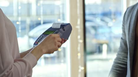 man making purchase with credit card