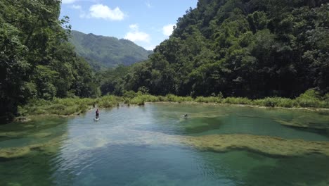 AERIAL:-People-in-Semuc-Champey-waterfalls-in-Guatemala