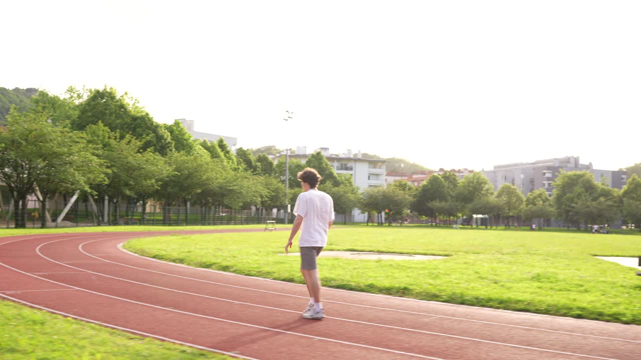 Man Running on Track in Park