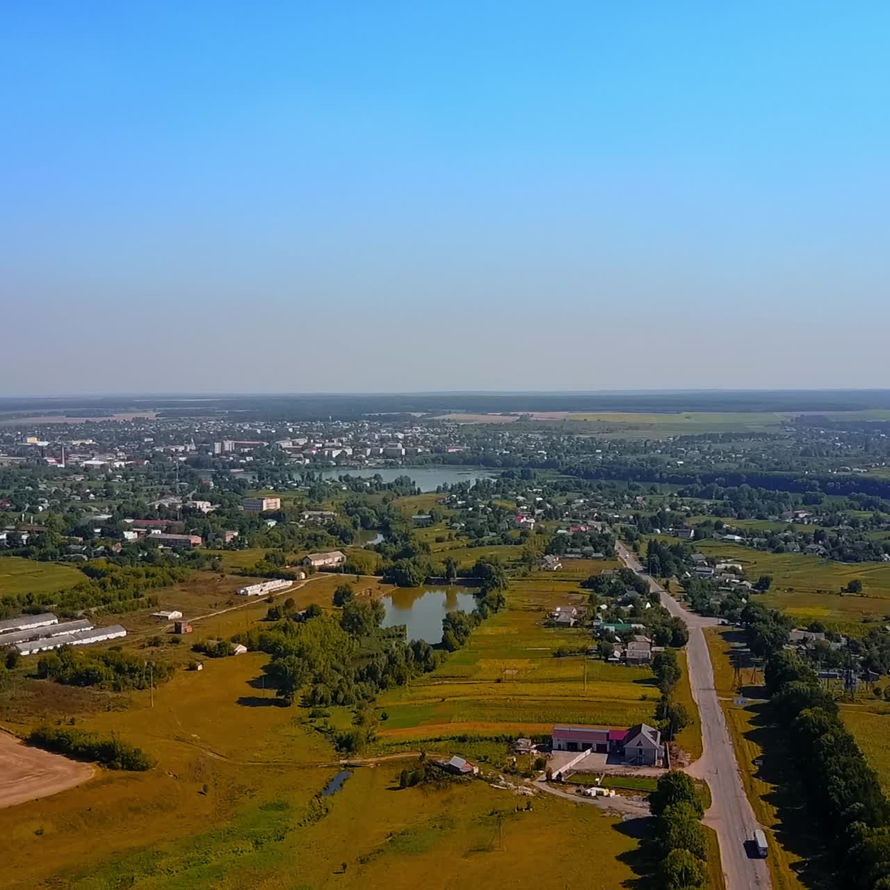 Picturesque landscape of Ukrainian rural area. Rising above the magnificent view over the fields, villages and rivers on sunny day