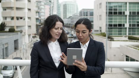 content businesswomen using tablet computer