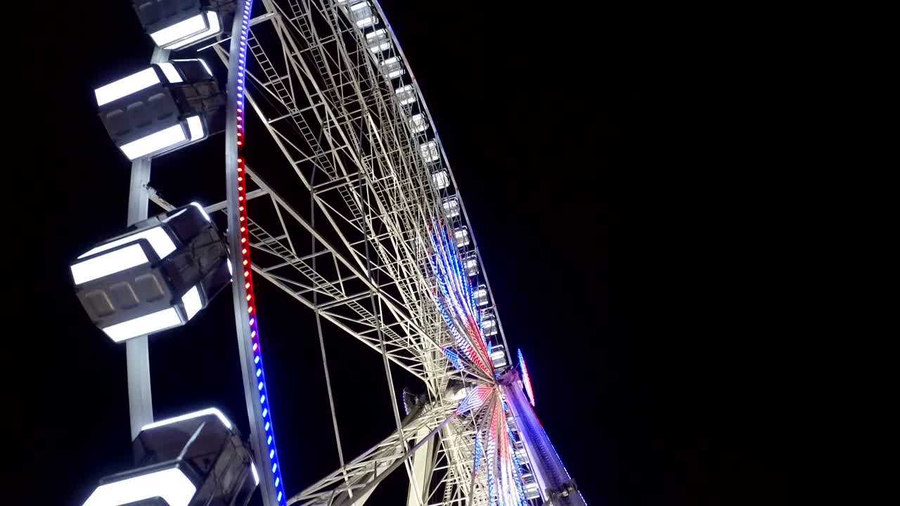 Panorama of Paris cityscape with Ferris wheel at night