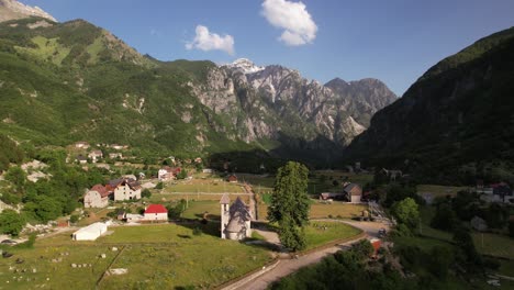 alpine village of theth in albania on beautiful valley surrounded by high mountains