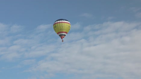 tracking shot of the headlands hotel hot air balloon flying over newquay