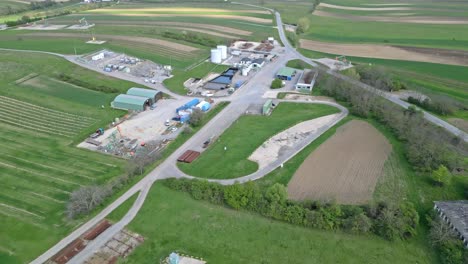 Aerial-View-Of-Oil-Company-Facility-With-Pumpjack-In-An-Oil-Well