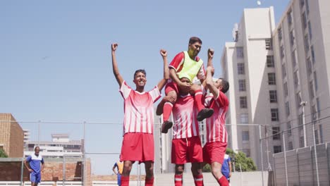 soccer players celebrating on field