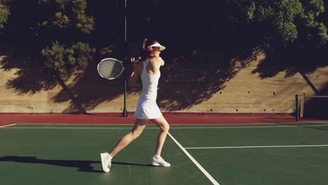 woman playing tennis on a sunny day