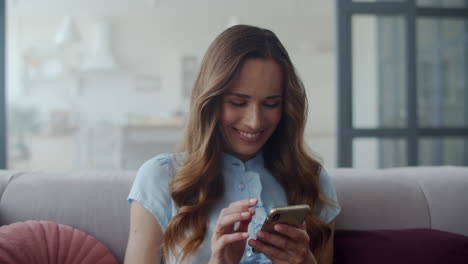 woman chatting on mobile phone at home office