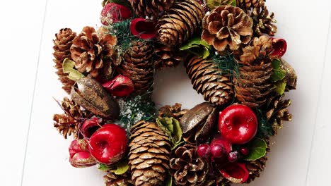 christmas wreath on white wooden background