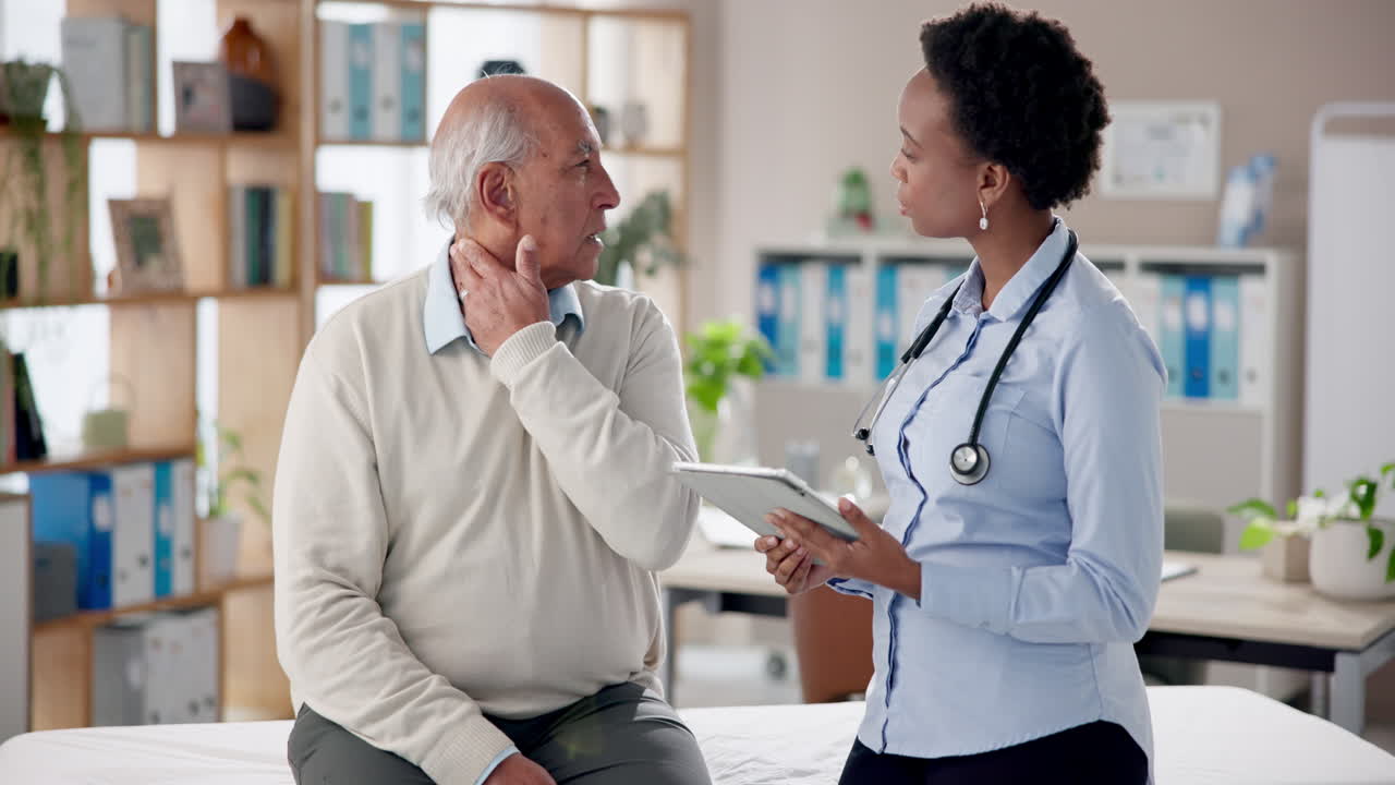 Doctor consulting with senior patient