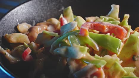 a closeup slowly panning left to right of a beautiful, crisp low calorie chicken salad in a skillet