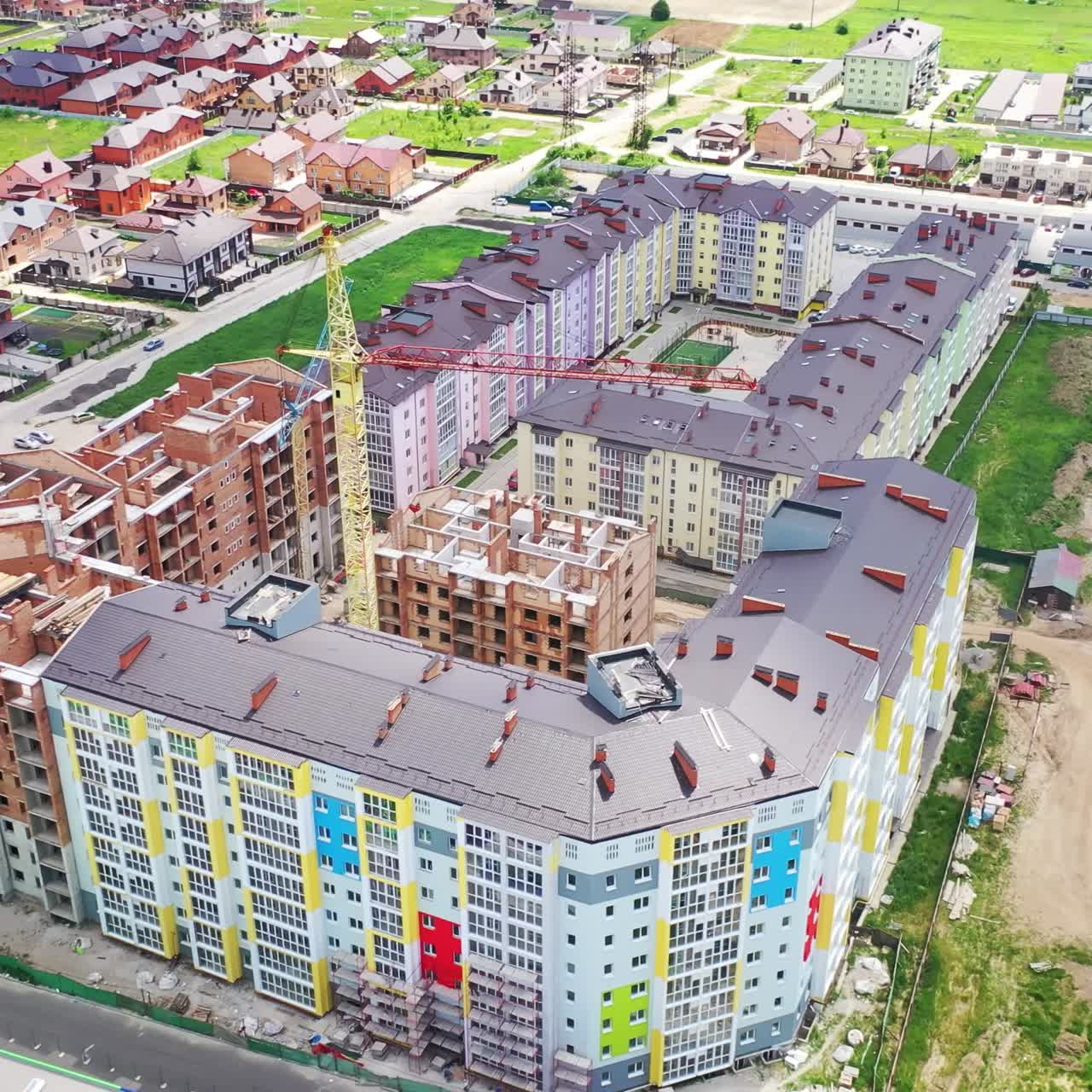 Flying over the construction site. Aerial view of construction of the plant in the city