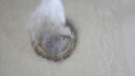 water pouring from a faucet tap slow motion