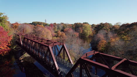 Aerial-view-of-the-Secondary-Trail-Truss-Bridge-over-the-Pawtuxet-River,-West-Warwick