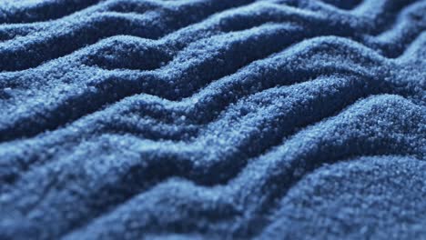 video of close up of blue coloured sand with pattern and copy space background