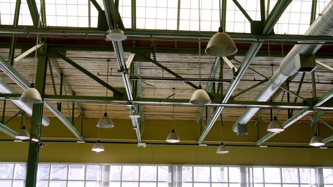 Industrial lighting in a warehouse with video dolly left to right.