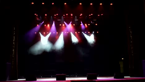 stage lights. several projectors in the dark.