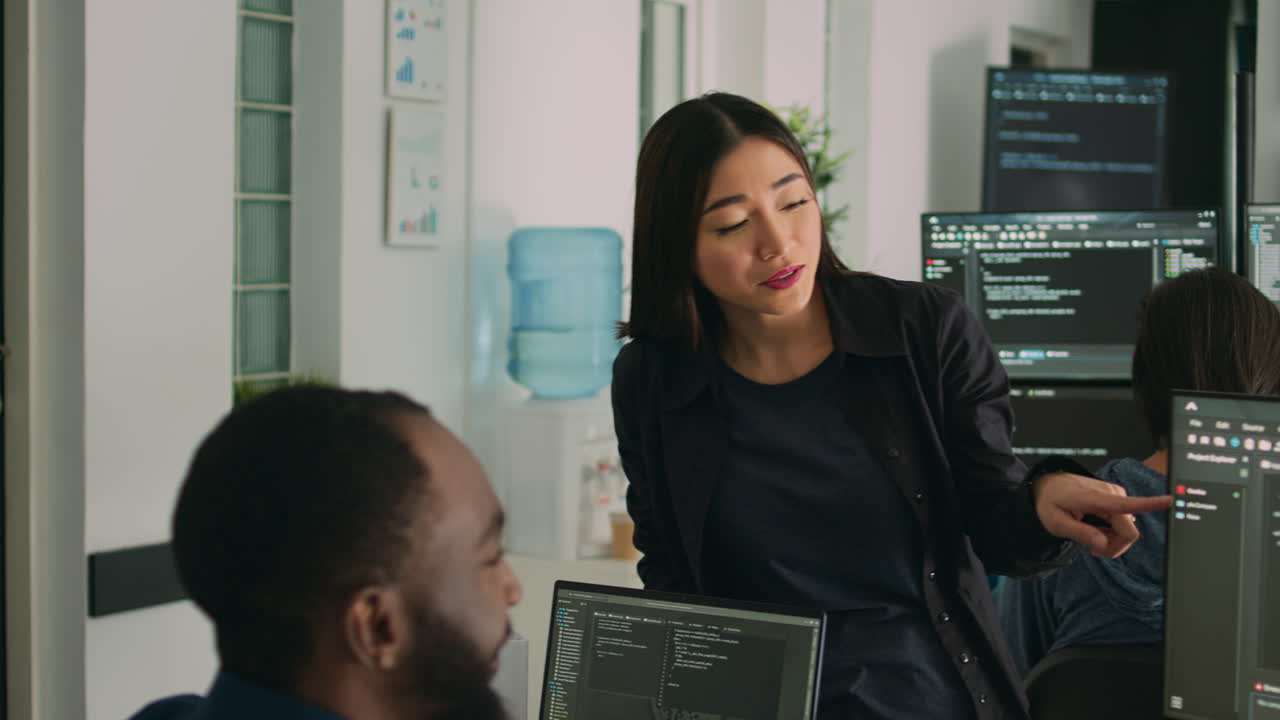 System engineers celebrating successful code compiling