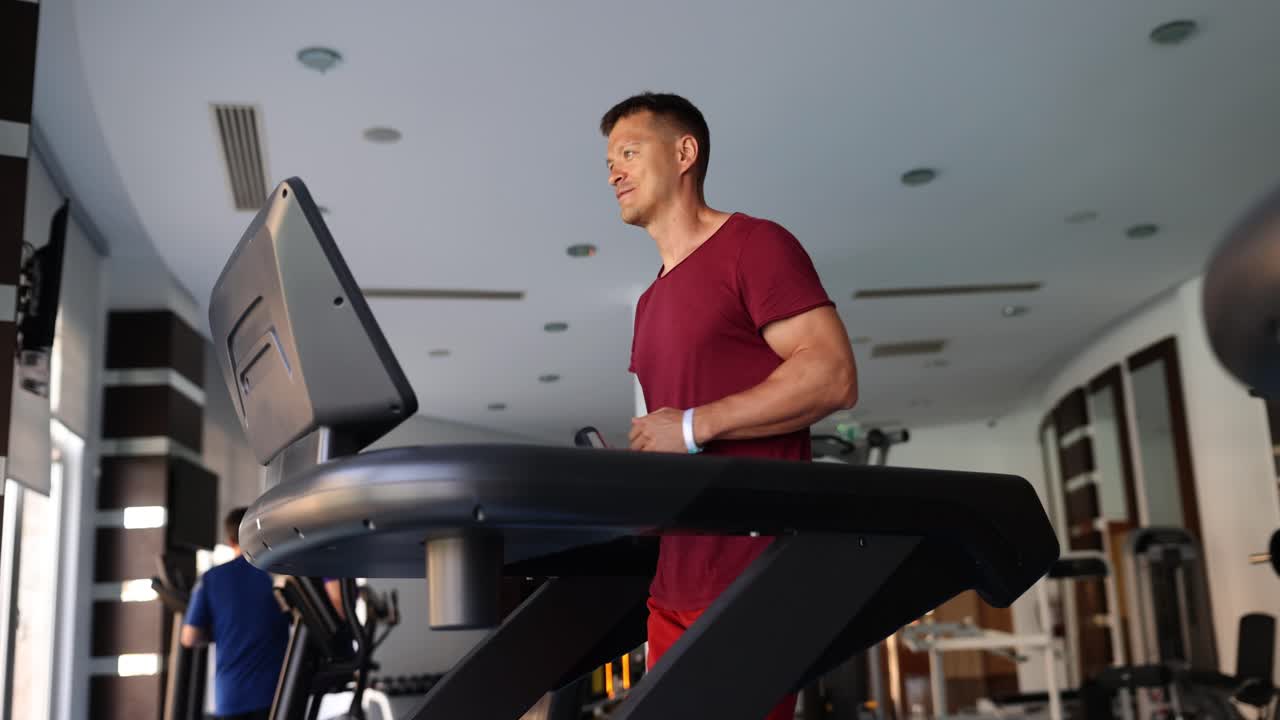 Man working out on treadmill in gym