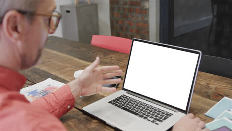 Caucasian-businessman-on-laptop-video-call-with-blank-screen