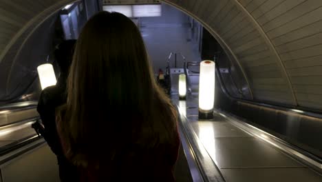 people on a subway escalator