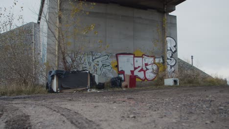 Old-unnecessary-furniture-and-a-lot-of-rubbish-dumped-under-the-bridge