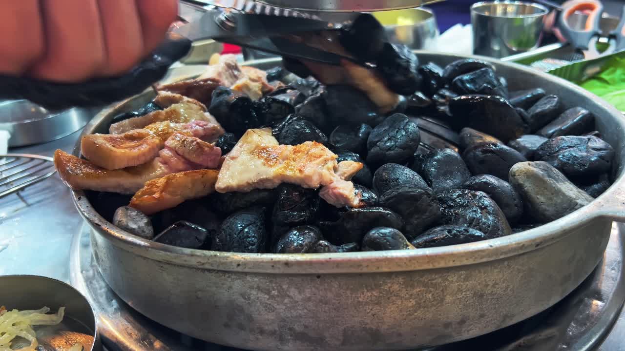 Samgyeopsal - Cooking A Popular Korean Barbecue Dish In Seoul, South Korea. - closeup shot