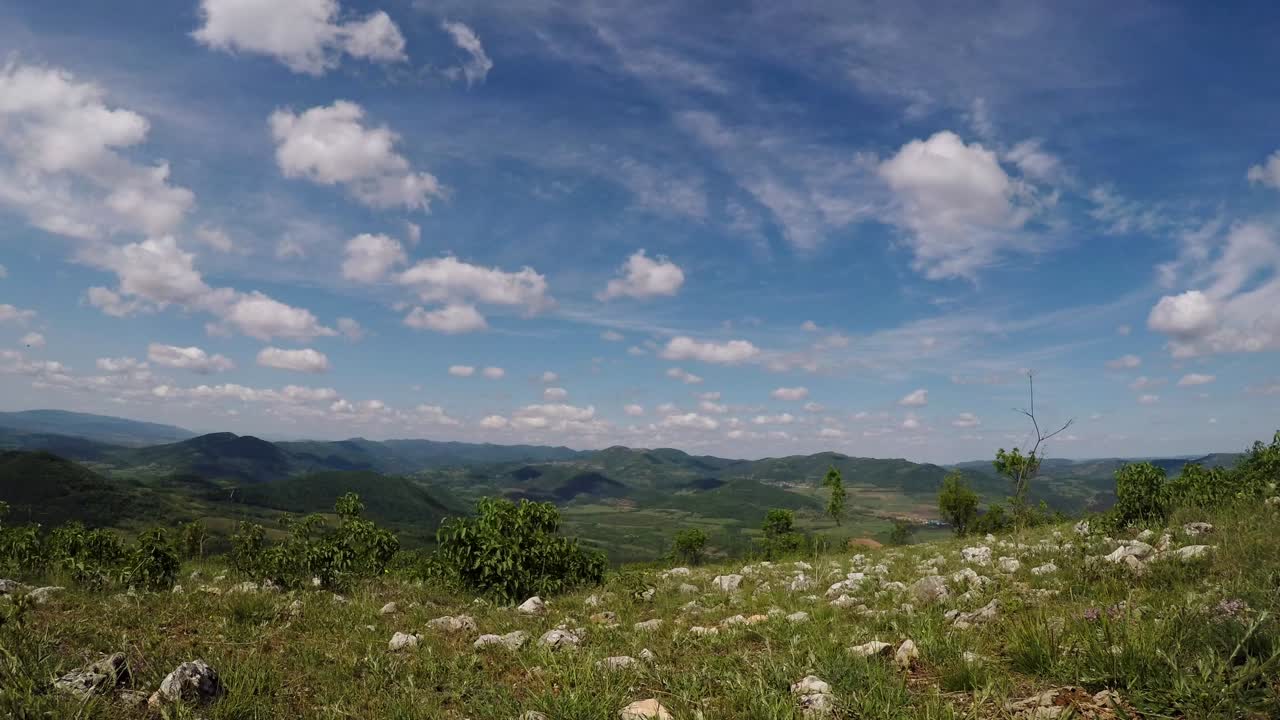 Timelapse from the top of a hill looing at a valley