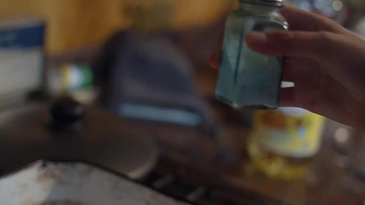 Seasoning a raw piece of beef - Warm house vibes - cooking at home - 4k at 60fps (slowmotion)