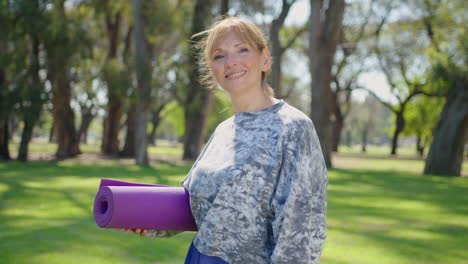 woman practicing yoga in a park