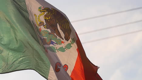 mexican flag flowing in the sunshine