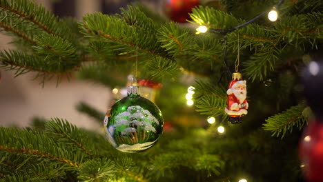 decorating christmas tree in december with christmas balls