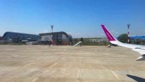 plane window view takeoff suceava airport in romania, fly airplane wing view