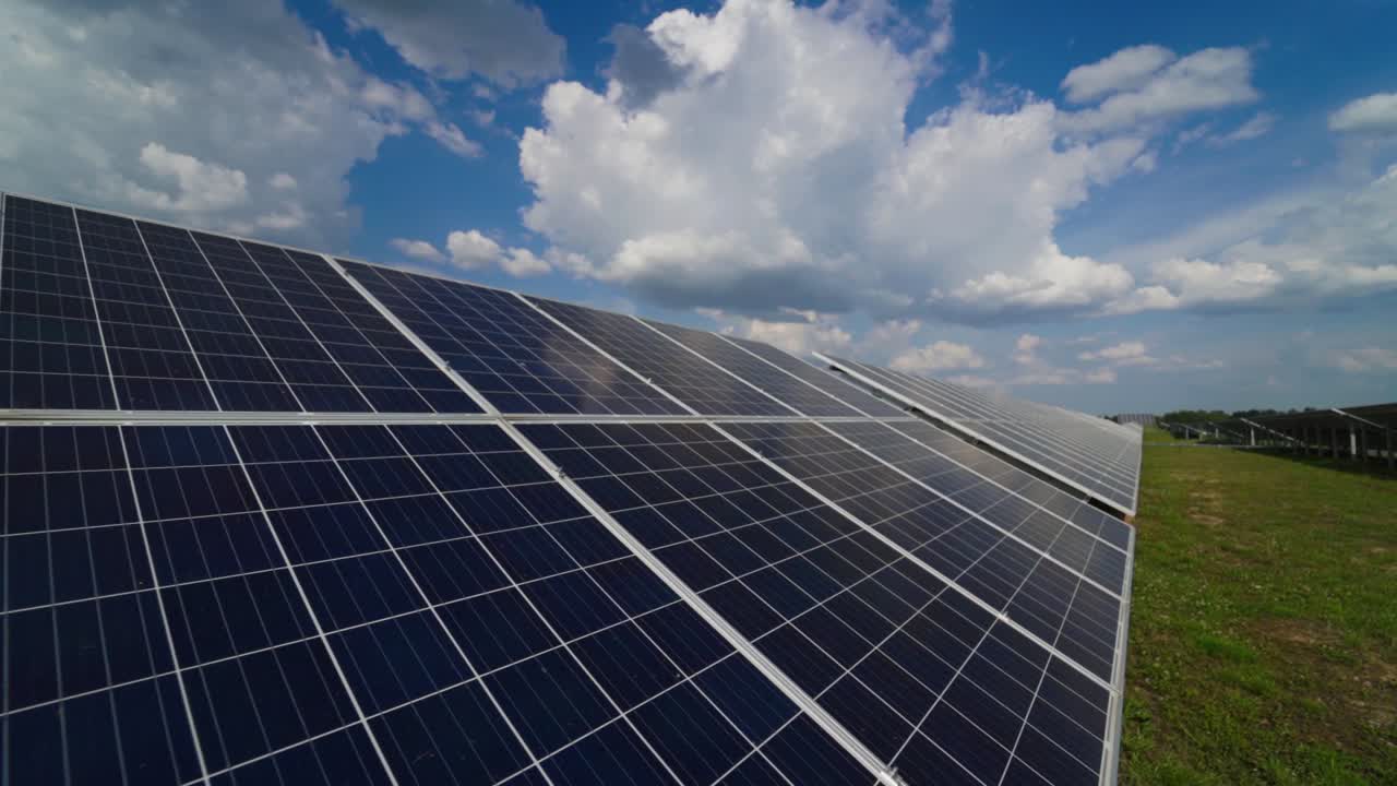 Photovoltaic solar panel on the modern electric power plant. Close view of innovative source of energy. Solar farm. Motion camera back.