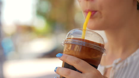 woman drinking chocolate cocktail outdoor