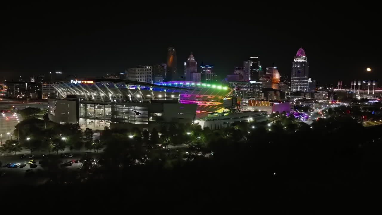 Drone shot orbiting the illuminated Paycor Stadium, Blink in Cincinnati, USA