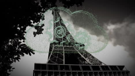 eiffel tower with digital cloud and gears animation overlaying structure