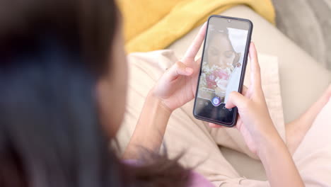 taking photo of cake, teenager using smartphone while relaxing indoors