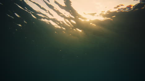 Underwater-view-of-breaking-wave-at-early-morning-light