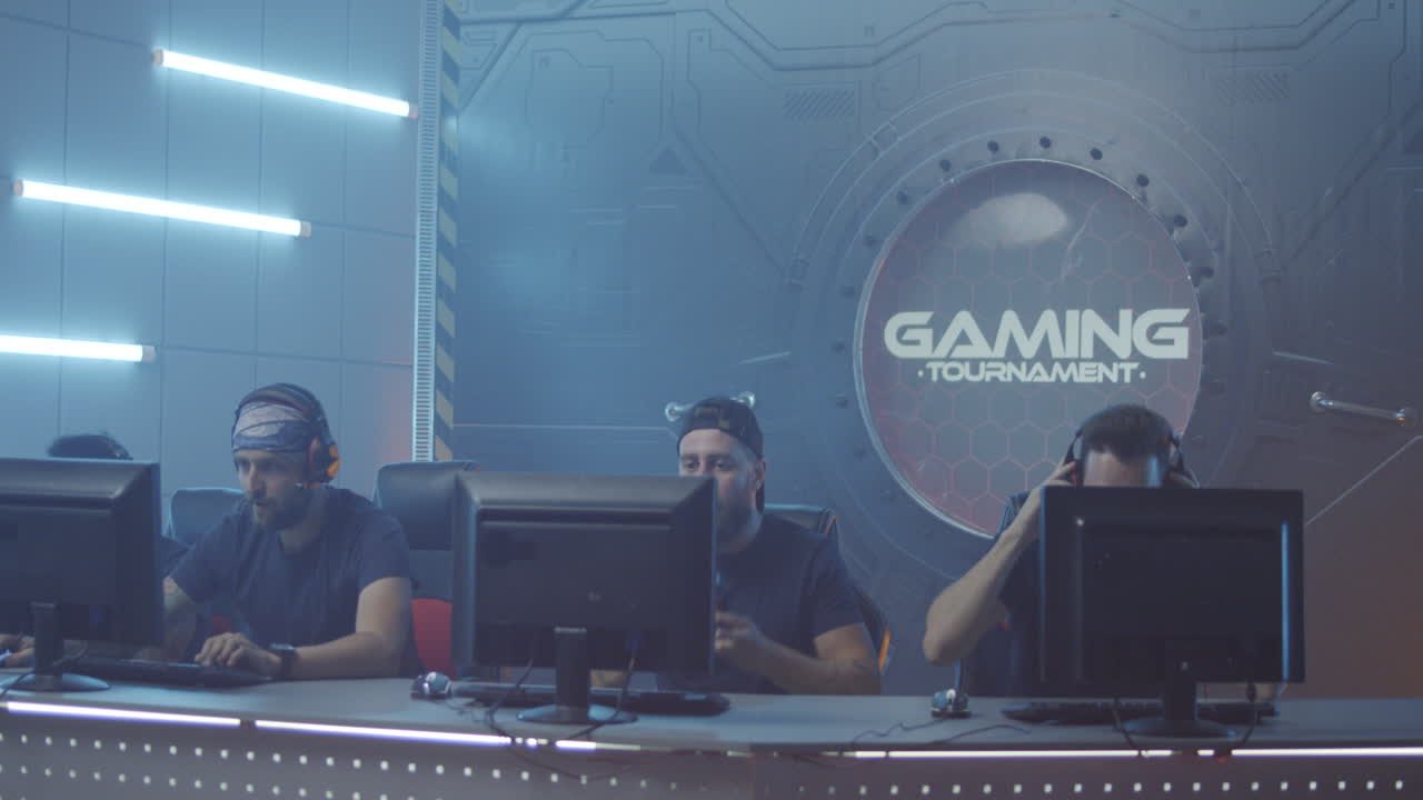 Gaming Team Relaxing before Match Medium Shot of Members of a Gaming Team Talking and Relaxing before a Match