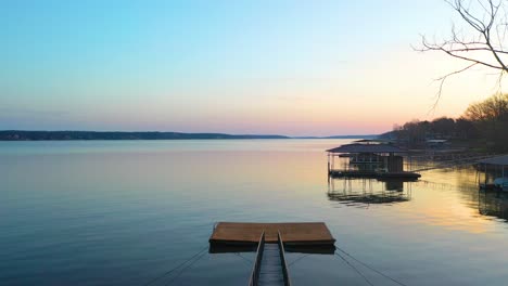 Narrow-Wooden-Bridge-With-Metal-Handrail-And-Dock-By-The-Lakeshore-Of-Grand-Lake-O'-the-Cherokees-In-Oklahoma