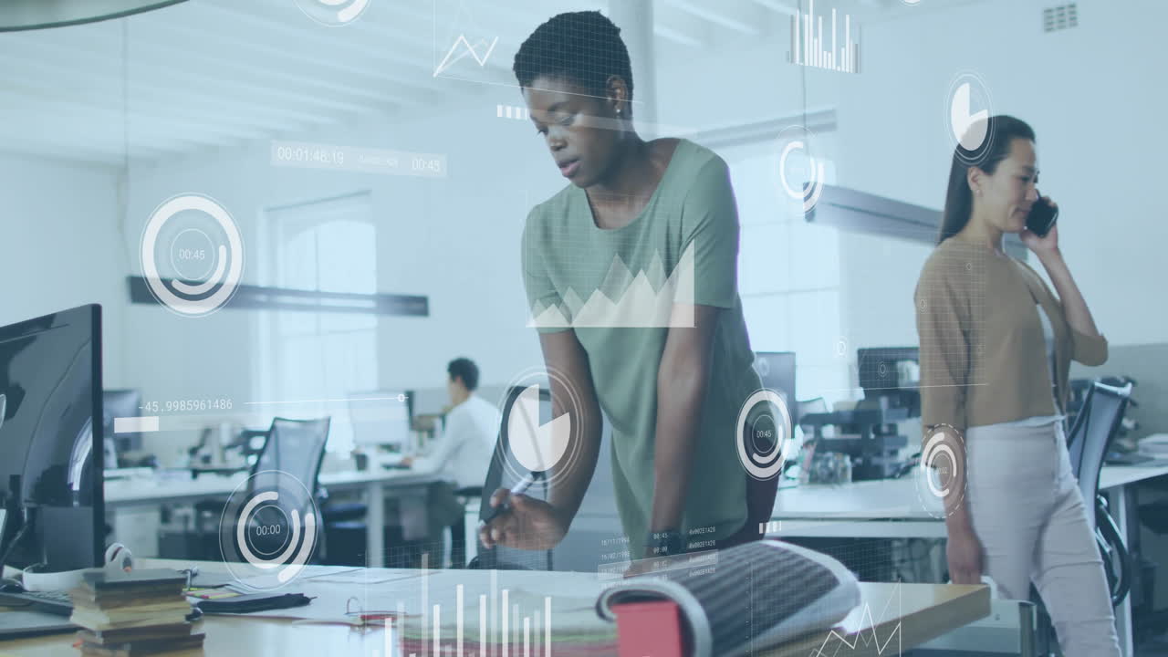 Analyzing data and charts animation over diverse business people in modern office