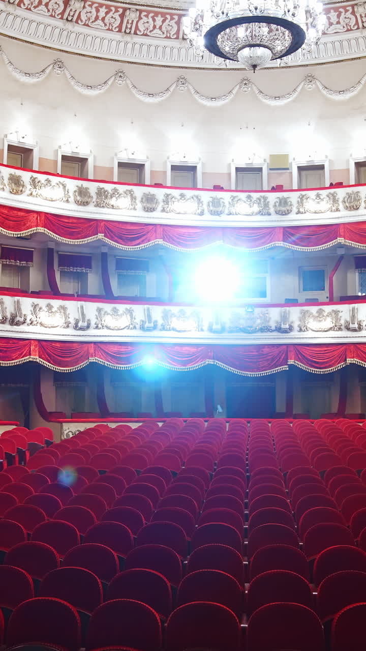 Empty rows of seats in theater. Concept of quarantine, cancellation of mass events to prevent spread of coronavirus infection. Vertical video