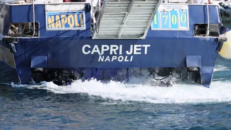 passenger ship leaving sorrento, creating waves