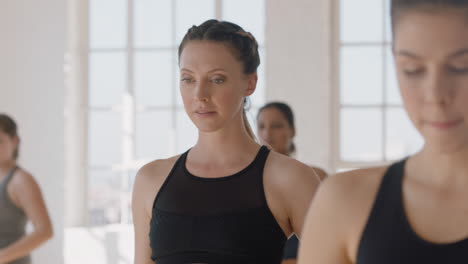 yoga class portrait young pregnant caucasian woman practicing poses holding belly enjoying group exercise in fitness studio