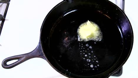 a tab of margarine containing trans fats melts in a hot skillet 1